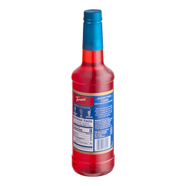 A red plastic bottle of Torani Sugar-Free Cherry Flavoring Syrup with a blue label.