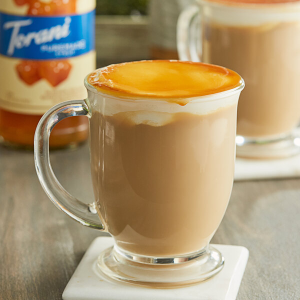 A glass mug of coffee with Torani Salted Caramel Syrup.