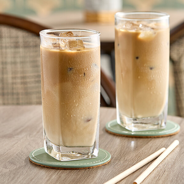 Two glasses of Dr. Smoothie Cafe Essentials Vanilla Latte on a table.