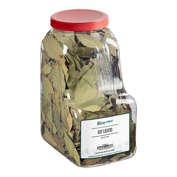 A plastic container of Regal Bay Leaves with a lid.