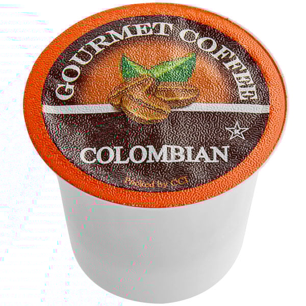 A white container of Caffe de Aroma Colombian Supreme Coffee Single Serve Cups with an orange and white label.