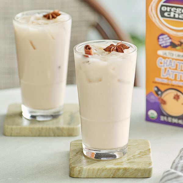 A close-up of a glass of Oregon Chai Salted Caramel Chai Tea Latte.