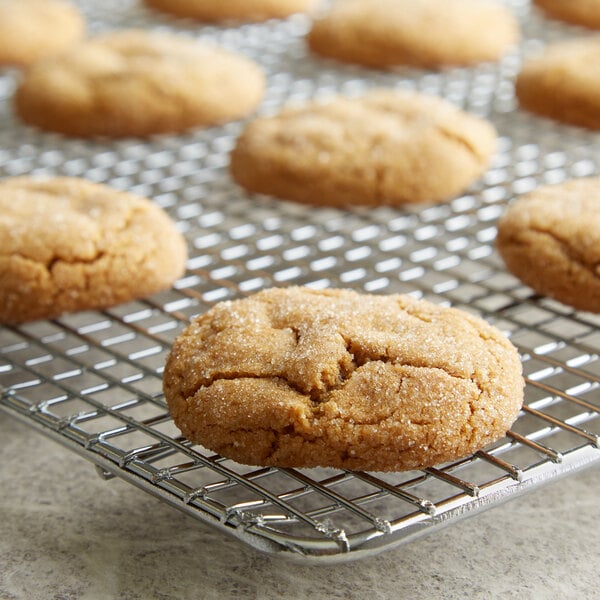 A close up of a cookie on a cooling rack.