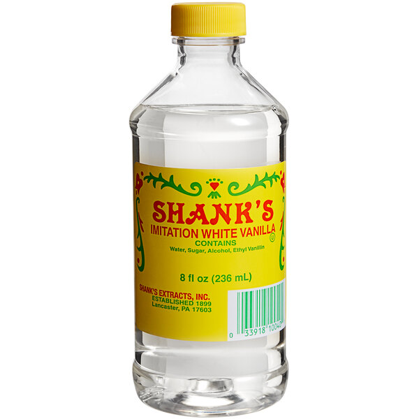 A close up of a bottle of Shank's White Imitation Vanilla with a yellow cap.