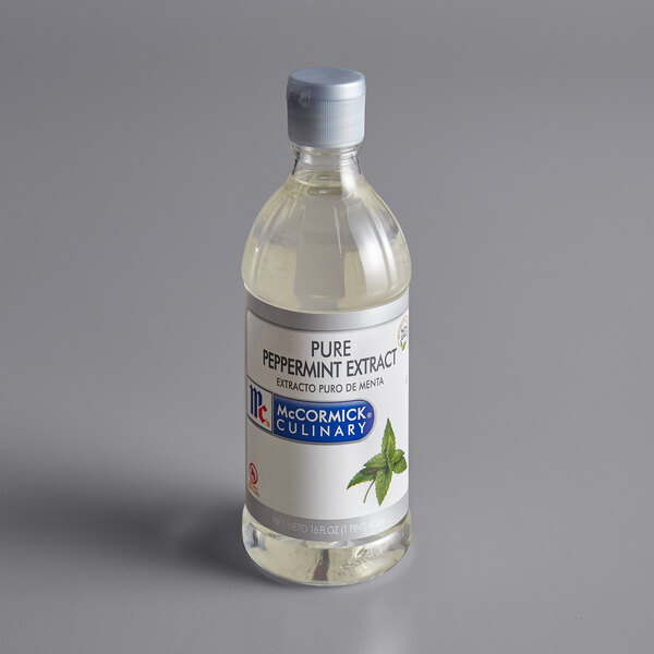 A close up of a McCormick Culinary Pure Peppermint Extract bottle with a label.