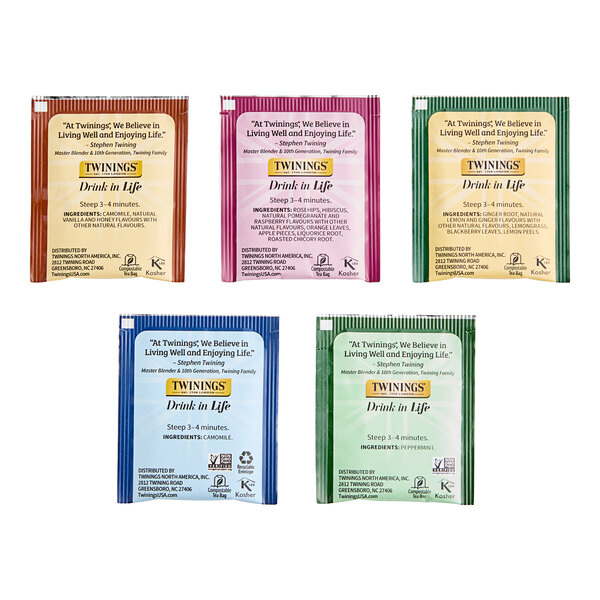 A case of Twinings assorted herbal tea bags with green, pink, and blue packages of tea.