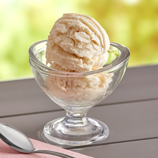 A bowl of Oringer Butter Pecan ice cream with a spoon on a napkin.