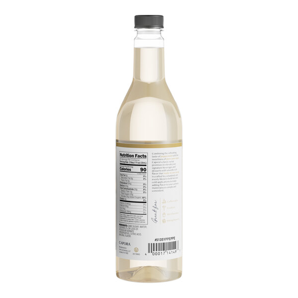 A close-up of a Capora Peppermint Flavoring Syrup bottle with a label.