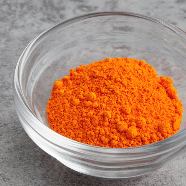 A bowl of Chefmaster orange dry powder.