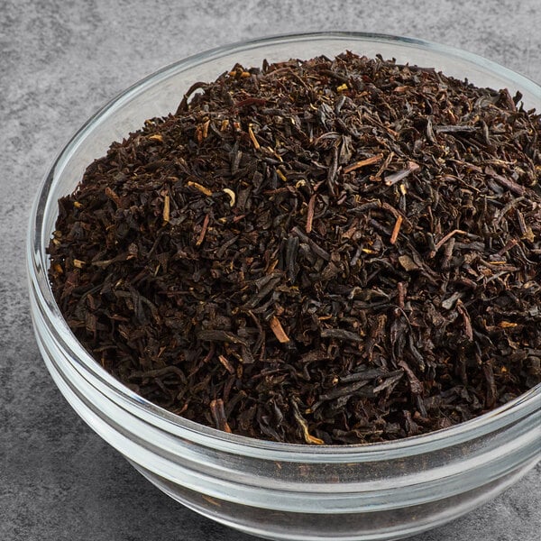 A bowl of Numi Organic Aged Earl Grey loose leaf tea.