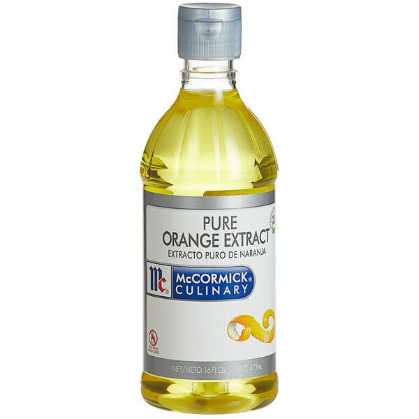 A case of 6 McCormick Culinary Pure Orange Extract bottles on a counter.