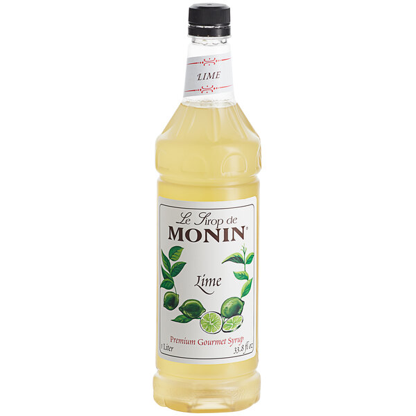 A close up of a Monin Lime Syrup bottle.