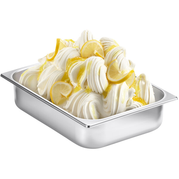 A metal tray with a bowl of Fabbri Nevepann cold process gelato base topped with lemon slices and a lemon wedge.