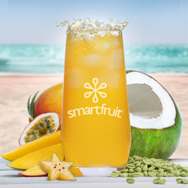 A close up of a glass of Smartfruit Revive beverage with ice and fruit floating in it.