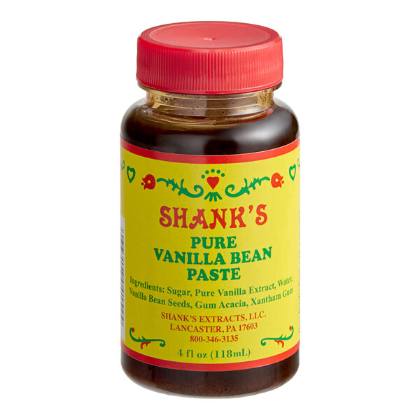 A 4 fl. oz. bottle of Shank's pure vanilla bean paste with a red cap and yellow label.