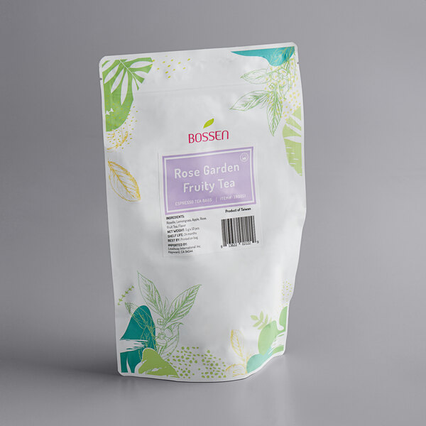 A white Bossen tea bag with green and white leaf designs and a purple label.
