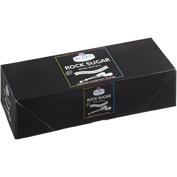 A black box with white and blue text reading "Dryden and Palmer White Rock Candy"