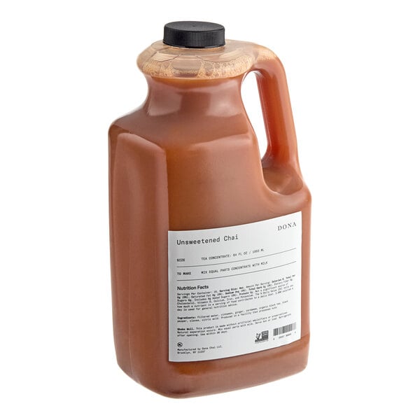 A white jug of Dona Unsweetened Chai Concentrate with a white label and a lid.