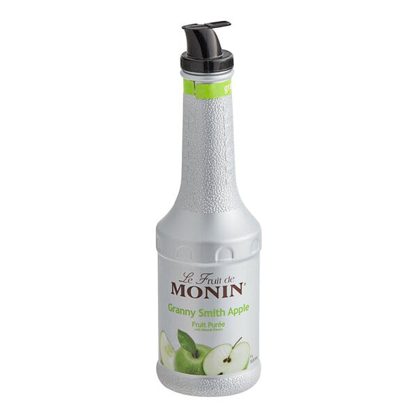 A close-up of a white Monin bottle of Granny Smith apple fruit puree.
