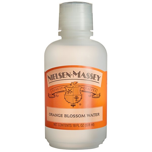A Nielsen-Massey plastic bottle of Orange Blossom Water with an orange label.