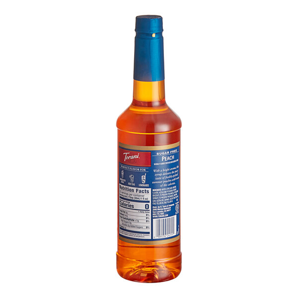 A Torani Sugar-Free Peach Flavoring Syrup bottle with a blue label.