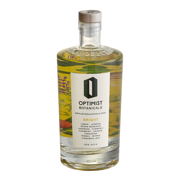 An Optimist Botanicals Bright Non-Alcoholic Spirit bottle with a white label filled with yellow liquid.