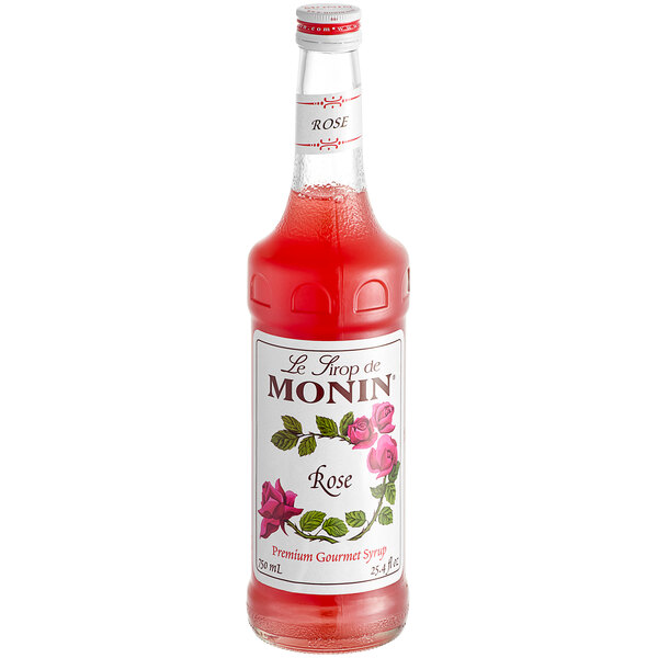 A Monin Premium Rose Flavoring Syrup 750 mL bottle with a label.