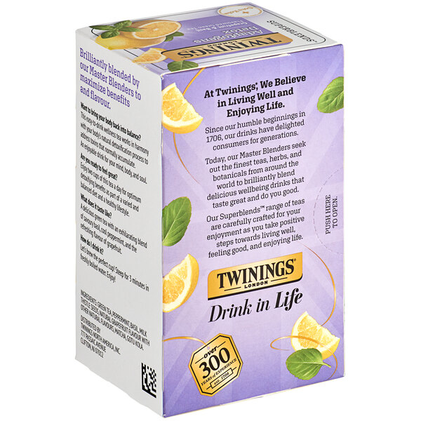 A white Twinings box of 18 grapefruit and basil green tea bags with images of grapefruits and basil leaves.