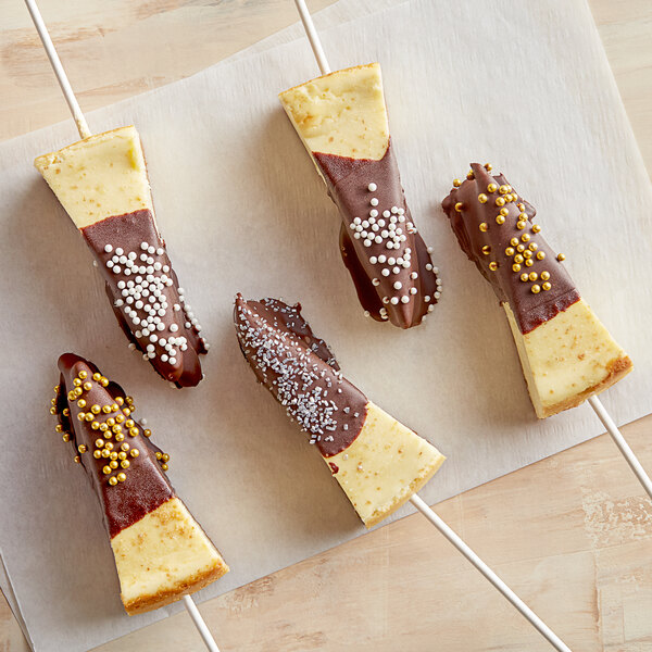 A group of Phillips chocolate covered cheesecake on a stick.