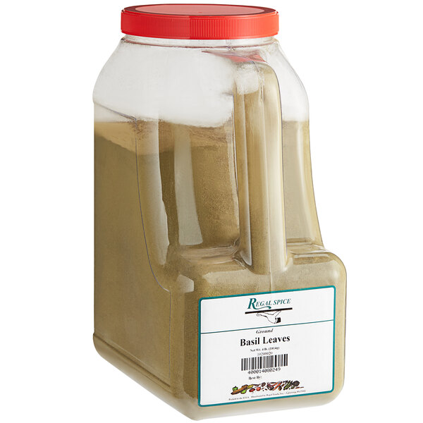 A white container of Regal Ground Basil Leaves with a lid.