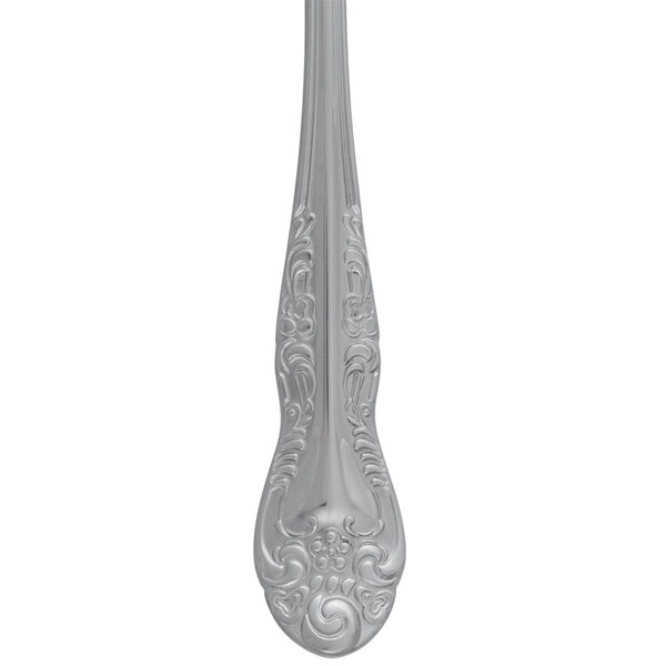 A Oneida Rosewood stainless steel salad or pastry fork with a design on the handle.