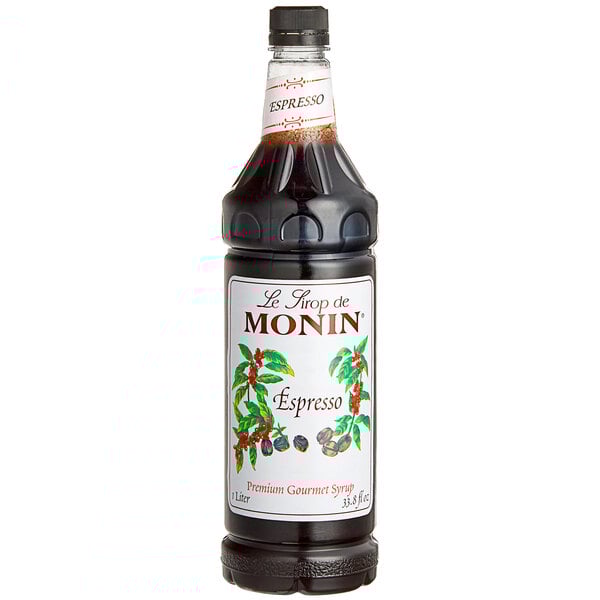 A close up of a Monin espresso syrup bottle with a label.