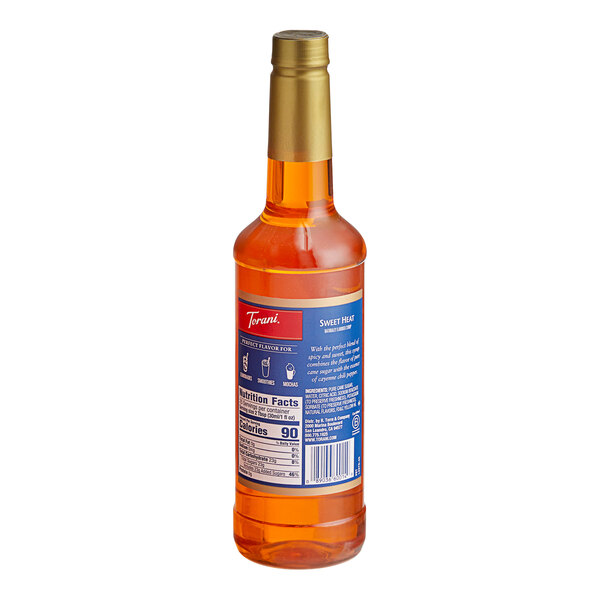 A close up of a Torani Sweet Heat Flavoring Syrup plastic bottle with a blue label.