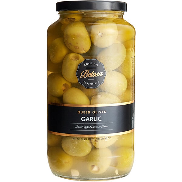 A jar of Belosa garlic stuffed queen green olives with a yellow label.