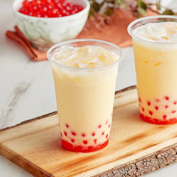 Two cups of milk tea with Bossen Pumpkin Spice Powder on top and red berries.