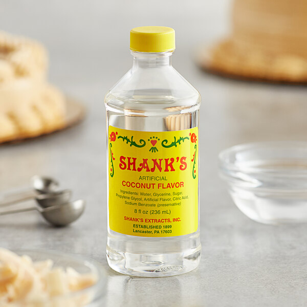 A close up of a bottle of Shank's Imitation Coconut flavor syrup.