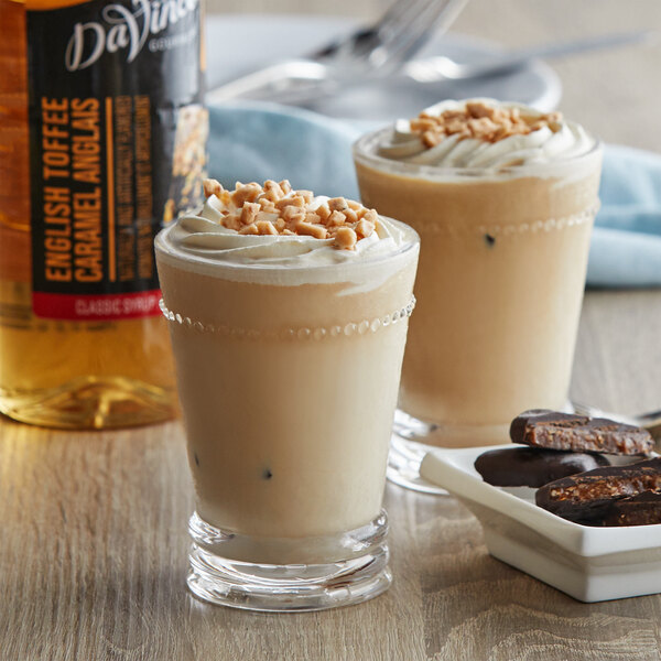 A glass of milkshake with DaVinci Gourmet English Toffee syrup on a table.