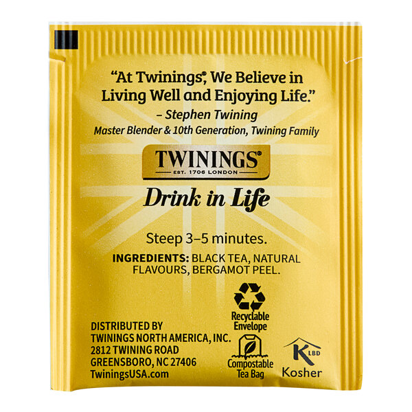 A yellow box of Twinings Earl Grey Extra Strong Tea Bags with black text.