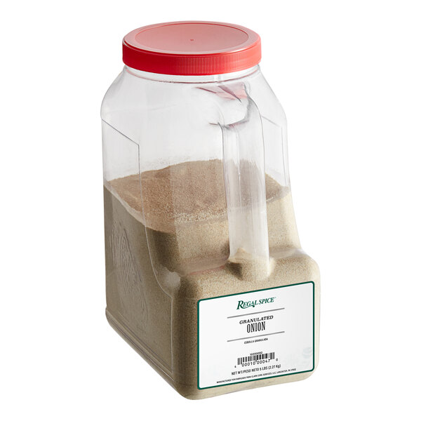 A plastic container of brown granulated onion powder with a lid.