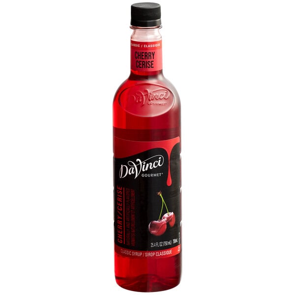 A close up of a DaVinci Gourmet Classic Cherry Flavoring syrup bottle with a red label.