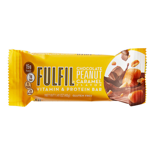 A FULFIL chocolate peanut caramel protein bar on a counter.