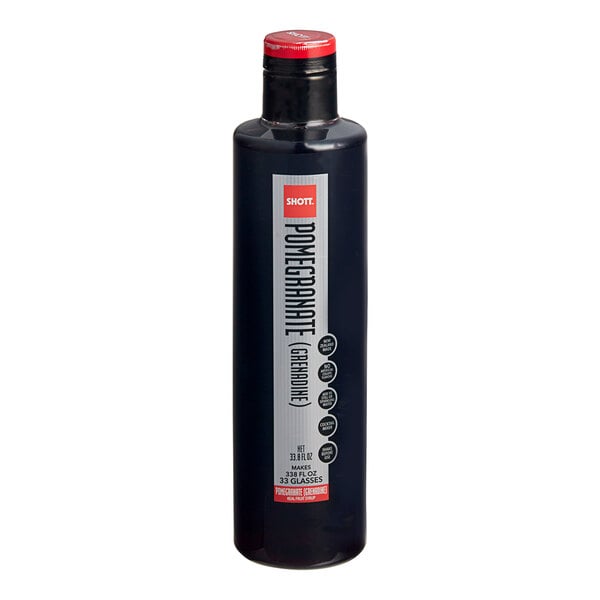 A black bottle of SHOTT Pomegranate Real Fruit Flavoring Syrup with a black and white label.