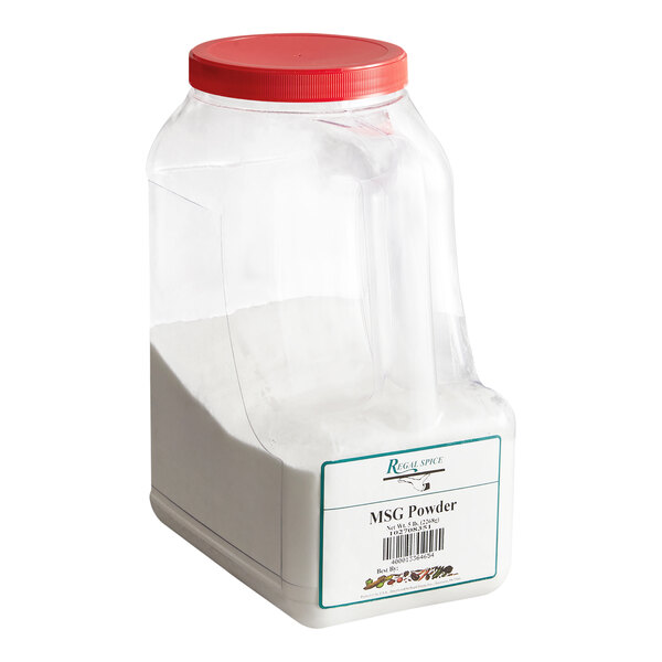 A large plastic container with a red lid filled with MSG powder.