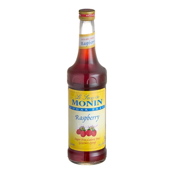 A bottle of Monin Sugar-Free Raspberry Fruit Syrup with a yellow label.