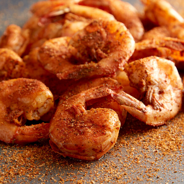 A plate of fried shrimp with Regal Bay Seafood Blend spices on it.