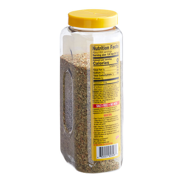 A close up of a Dash Salt-Free Original Seasoning container with a yellow lid.