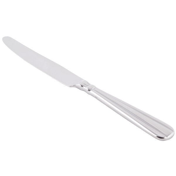 A close-up of a Oneida Unity stainless steel dinner knife with a handle.