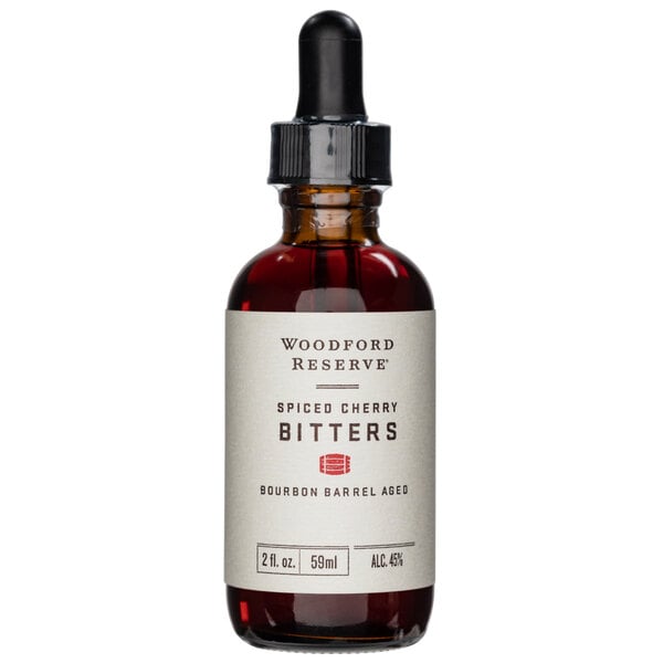 A Woodford Reserve bottle of Spiced Cherry Bitters with a dropper.