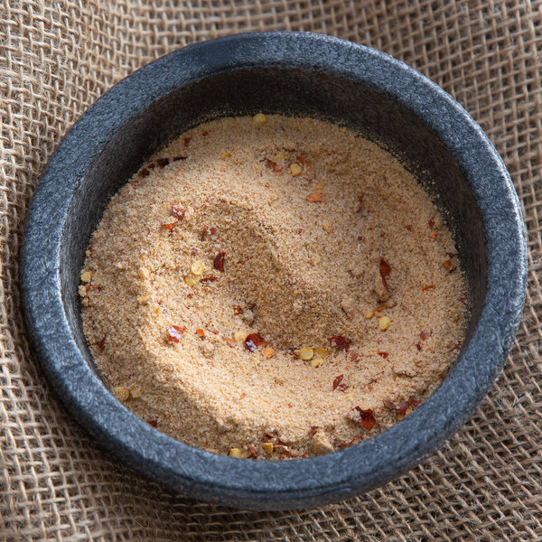 A bowl of Regal Fajita seasoning on a cloth.