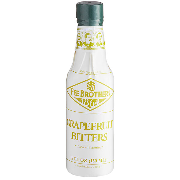 A white Fee Brothers bottle with yellow text and a green cap for grapefruit bitters.